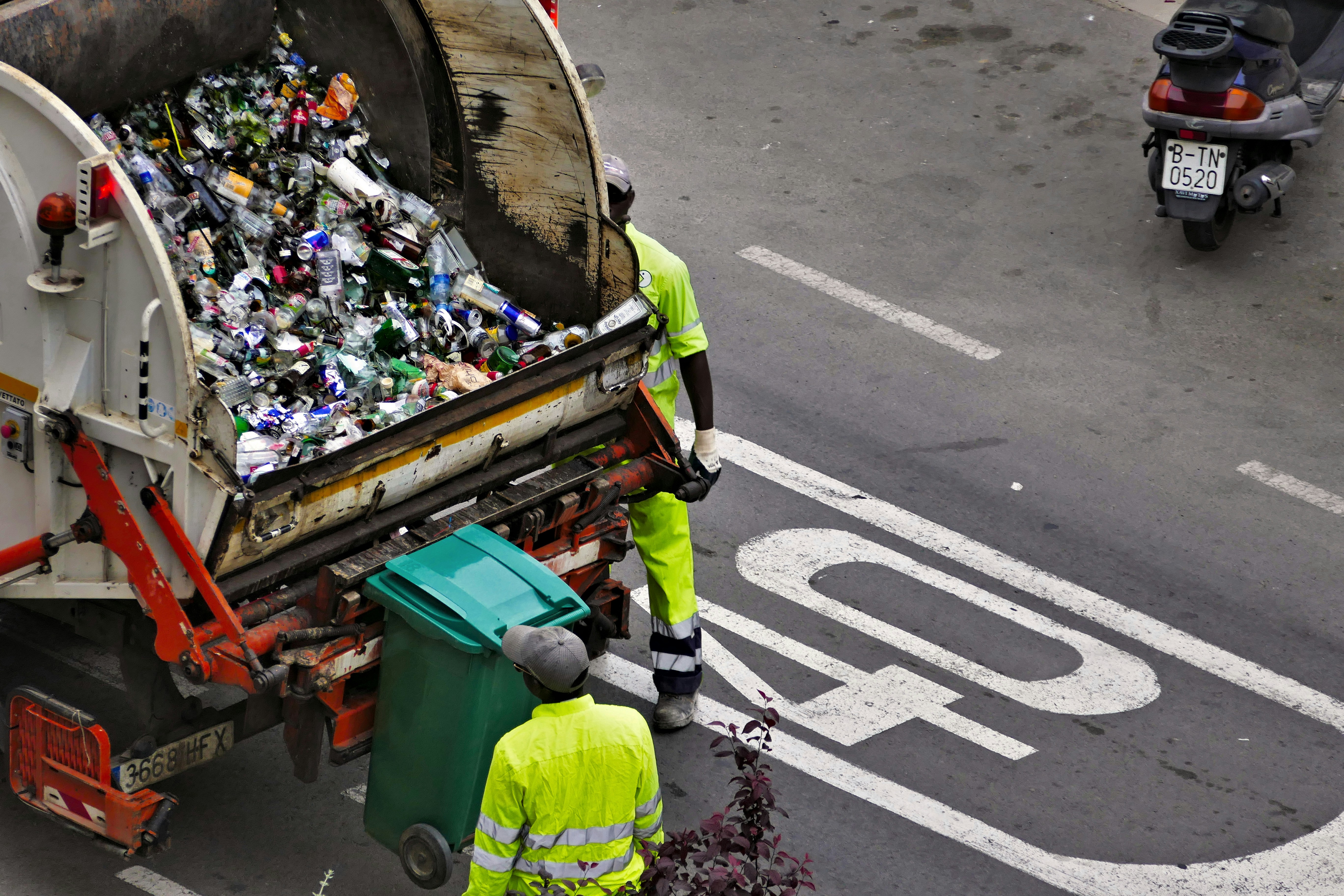 Workers managing waste